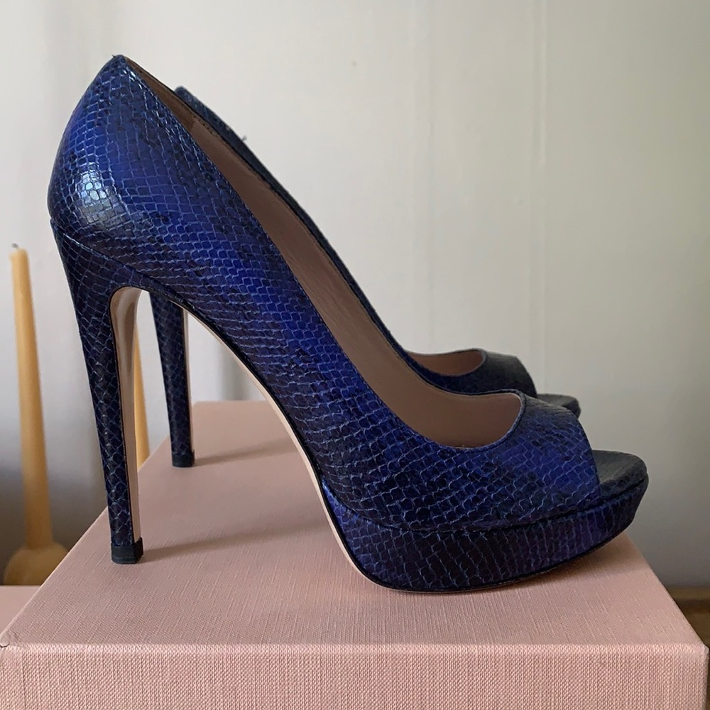 Miu Miu peep toe pumps.